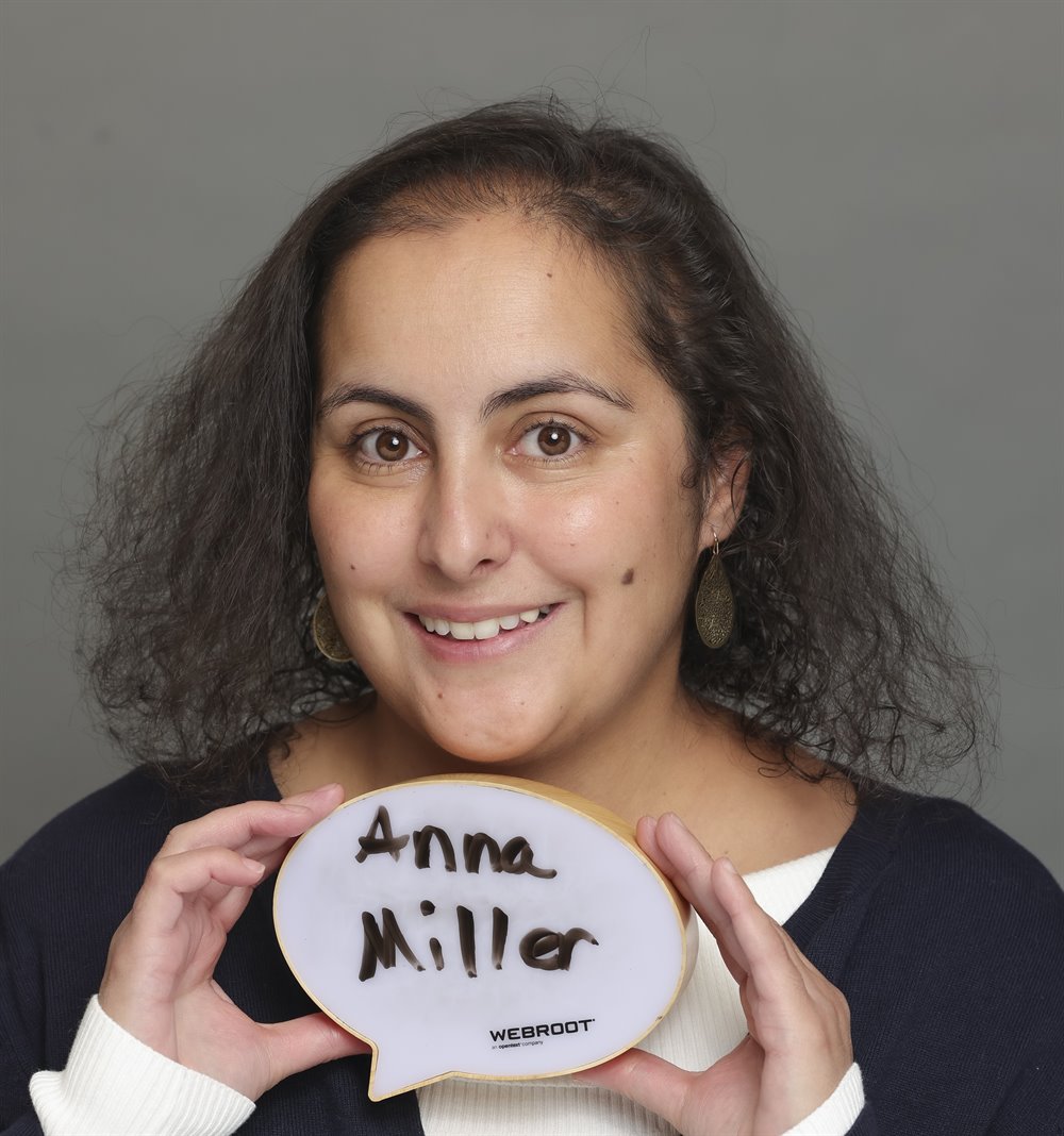 Anna Miller holding a speech-bubble sign with her name written on it